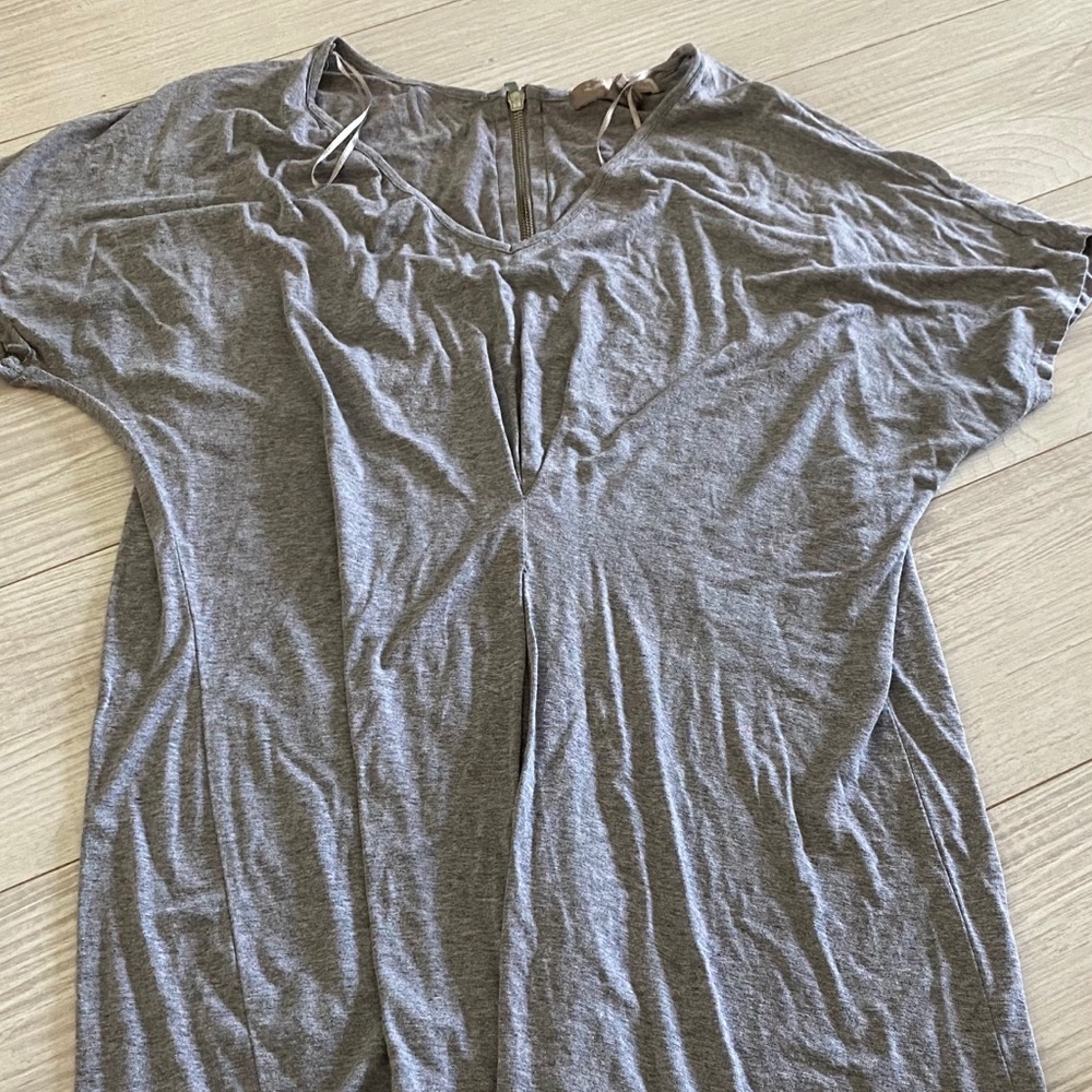 Grey shirt with zipper down back of neck